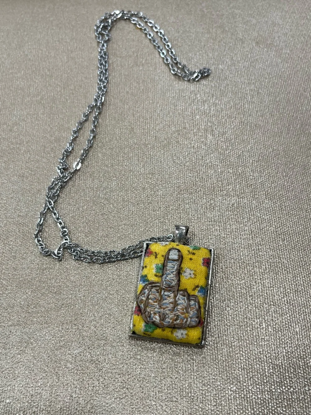 Middle finger hand embroidered pendant and necklace